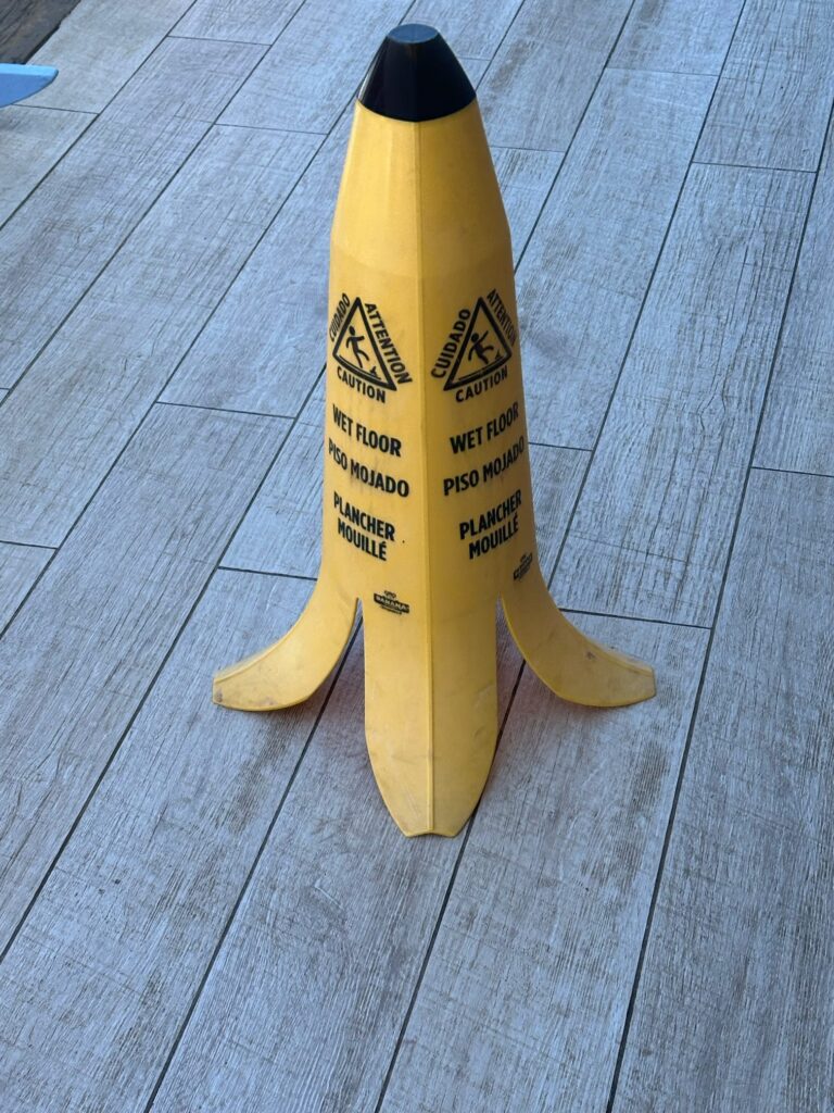 Banana peel wet floor sign captured in it's native environment at a property in Antigua.