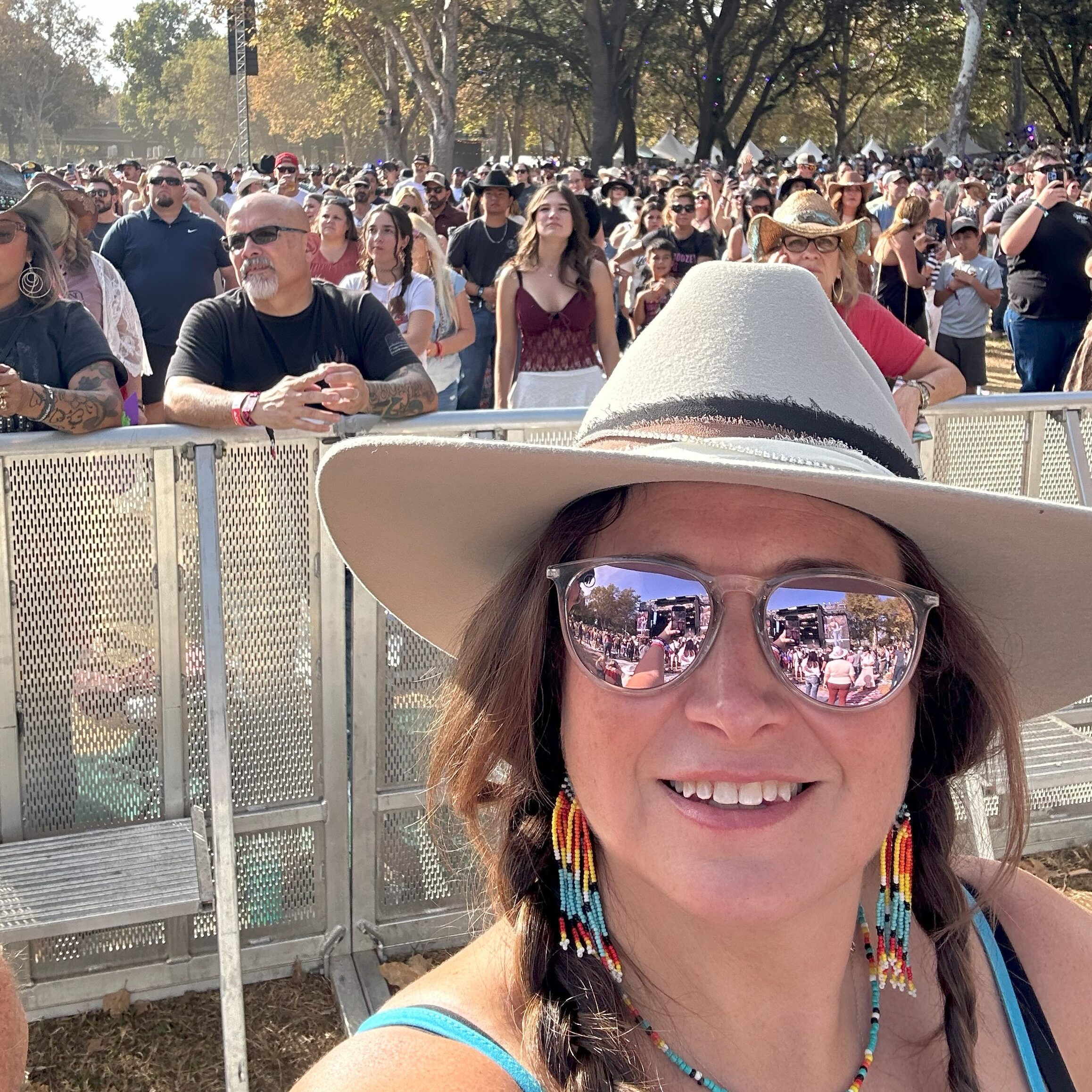 A crowd of people at a country music festival in Sacramento CA