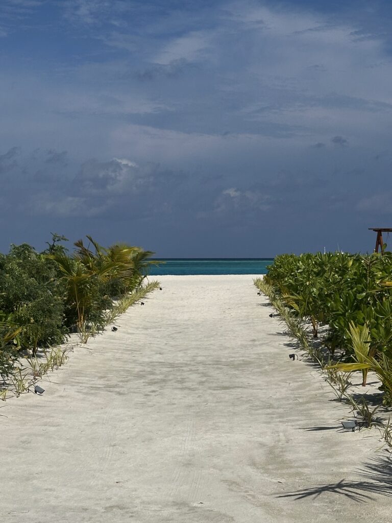Long walkway to the ocean in the Maldives